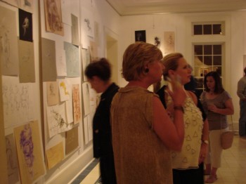 Guests viewing art at Figure Show opening